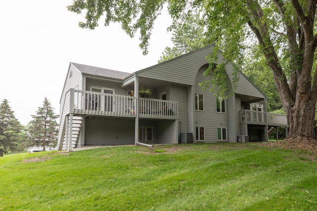 4887 Tee Ct SW, Rochester, MN 55902 - back of house with a yard and a wooden deck