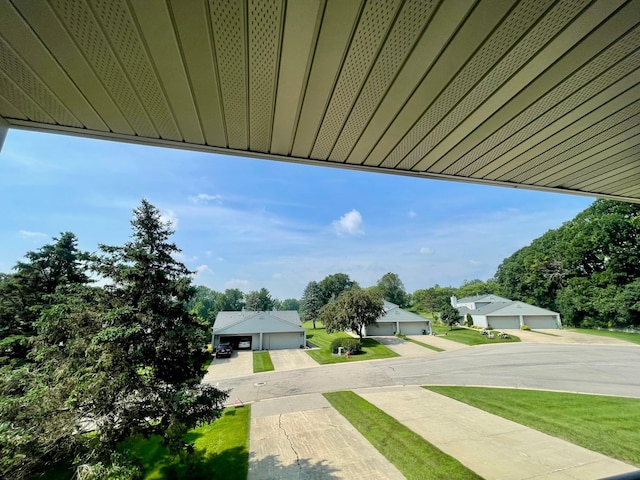 4887 Tee Ct SW, Rochester, MN 55902 - view of grassy yard with a detached garage