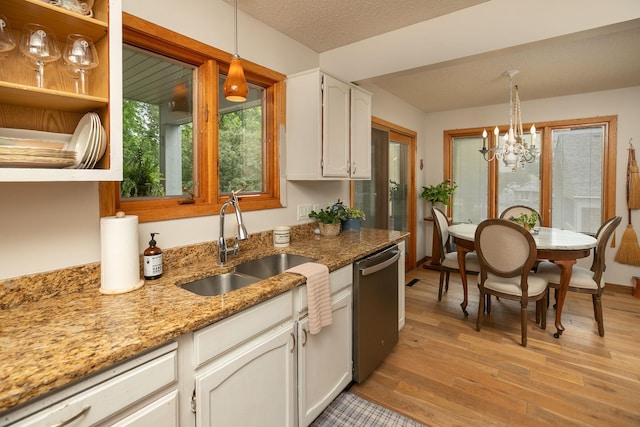4887 Tee Ct SW, Rochester, MN 55902 - kitchen with dishwasher, light wood finished floors, a chandelier, white cabinetry, and light stone counters