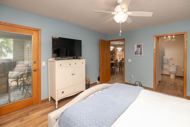4887 Tee Ct SW, Rochester, MN 55902 - bedroom with light wood-type flooring, a chandelier, ceiling fan, a textured ceiling, and ensuite bath
