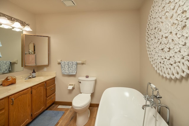 4887 Tee Ct SW, Rochester, MN 55902 - bathroom featuring wood finished floors, a freestanding tub, and double vanity