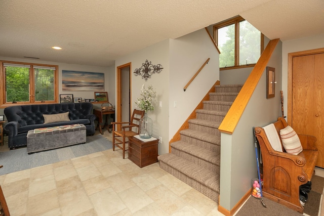 4887 Tee Ct SW, Rochester, MN 55902 - stairs with a textured ceiling and recessed lighting