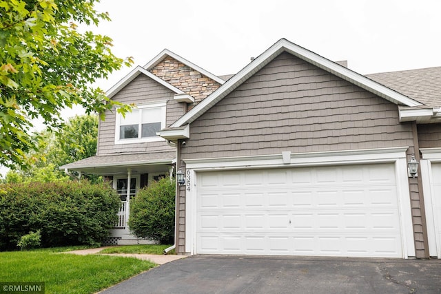 6354 151st Street Ct N, Hugo, MN 55038 - view of front facade featuring a garage, asphalt driveway, and roof with shingles