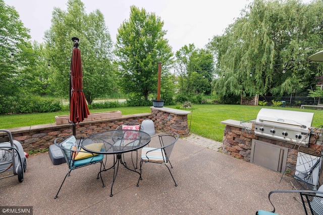 6354 151st Street Ct N, Hugo, MN 55038 - view of patio / terrace with area for grilling, view of wooded area, and outdoor dining area