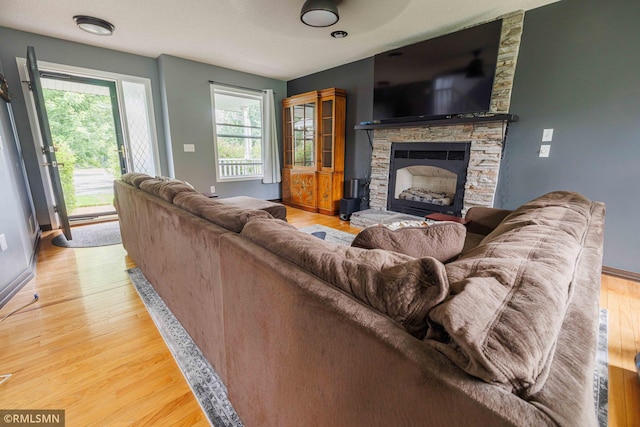 6354 151st Street Ct N, Hugo, MN 55038 - living room featuring a fireplace and light wood-style floors