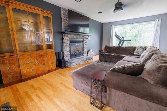 6354 151st Street Ct N, Hugo, MN 55038 - living room with wood finished floors and a stone fireplace