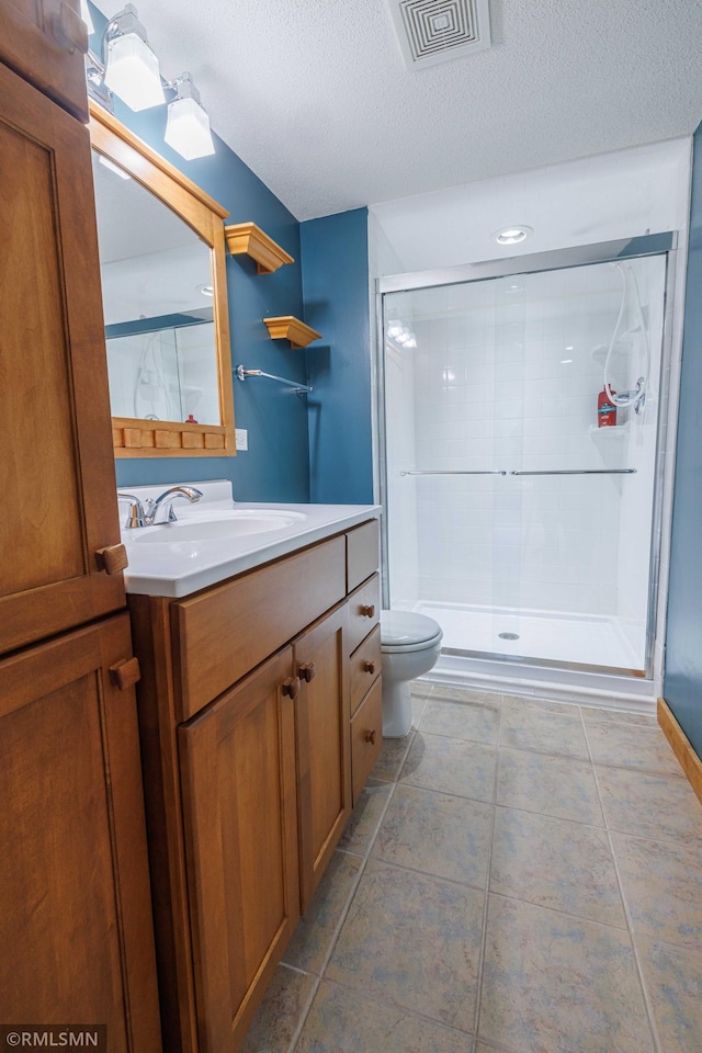 6354 151st Street Ct N, Hugo, MN 55038 - bathroom with vanity, a stall shower, and a textured ceiling