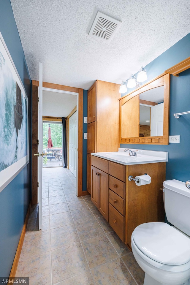 6354 151st Street Ct N, Hugo, MN 55038 - half bathroom featuring vanity and a textured ceiling