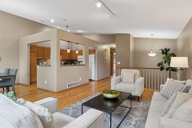 6160 Creek View Rdg, Minnetonka, MN 55345 - living area featuring light wood finished floors and lofted ceiling
