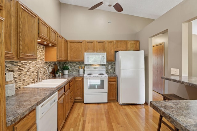 6160 Creek View Rdg, Minnetonka, MN 55345 - kitchen featuring white appliances, a ceiling fan, backsplash, brown cabinets, and lofted ceiling