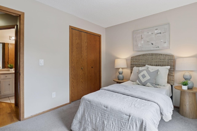 6160 Creek View Rdg, Minnetonka, MN 55345 - bedroom with light colored carpet, a closet, and ensuite bath