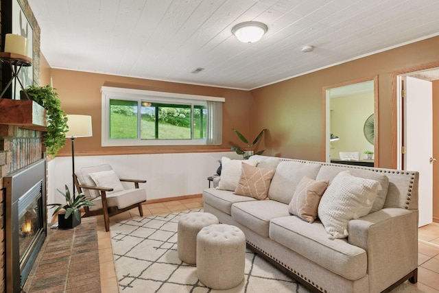 6160 Creek View Rdg, Minnetonka, MN 55345 - living area featuring a glass covered fireplace, tile patterned flooring, and crown molding