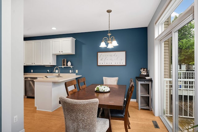 6715 158th St W, Apple Valley, MN 55124 - dining area with light wood-style floors, a chandelier, and recessed lighting