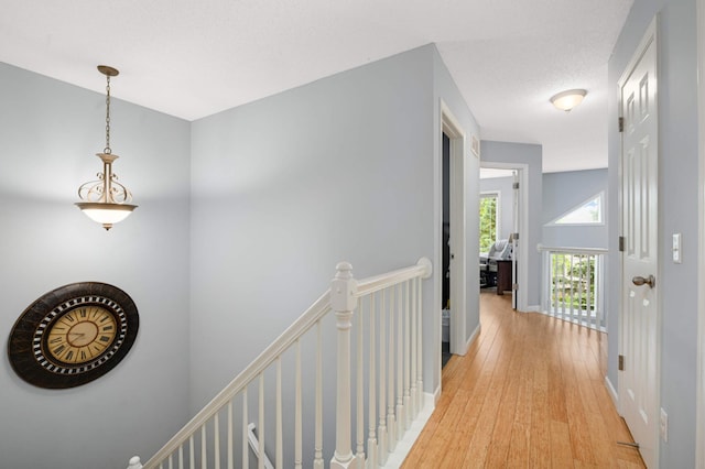 6715 158th St W, Apple Valley, MN 55124 - hallway featuring an upstairs landing and light wood-style flooring