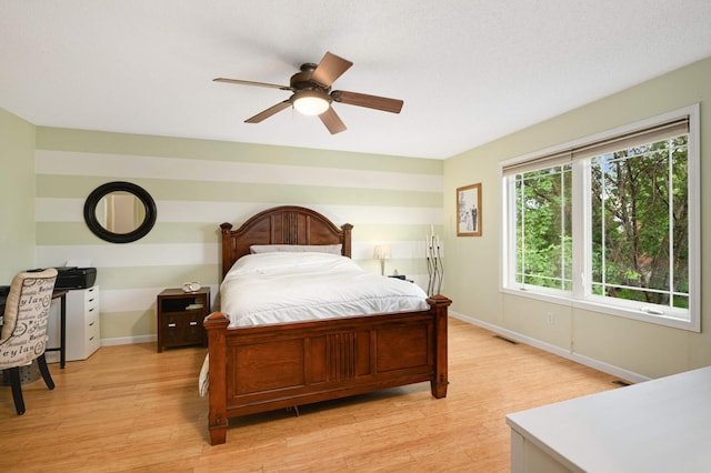 6715 158th St W, Apple Valley, MN 55124 - bedroom featuring light wood-style floors and a ceiling fan