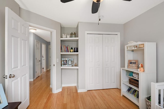 6715 158th St W, Apple Valley, MN 55124 - bedroom with light wood finished floors, a closet, and ceiling fan