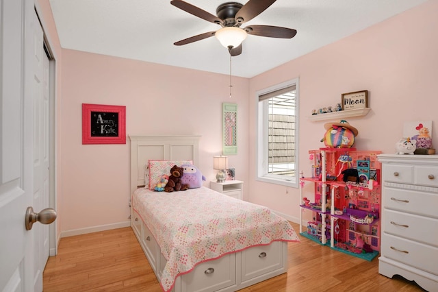 6715 158th St W, Apple Valley, MN 55124 - bedroom featuring light wood-type flooring, a closet, and ceiling fan