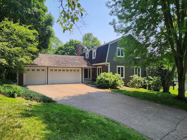 3900 Hillcrest Way, Deephaven, MN 55391 - dutch colonial with a gambrel roof, driveway, a garage, a chimney, and a front yard