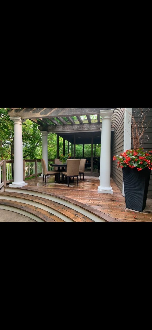 3900 Hillcrest Way, Deephaven, MN 55391 - patio at twilight featuring a pergola and outdoor dining area