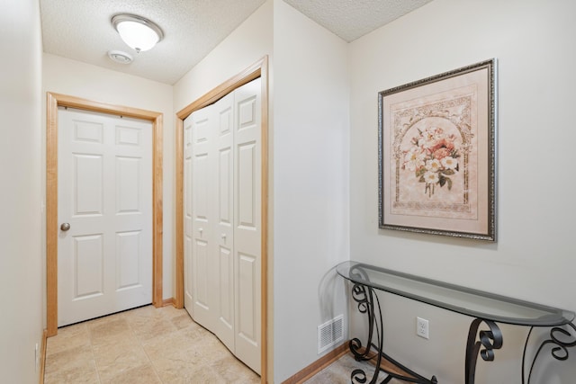 10751 Falling Water Ln Unit C, Woodbury, MN 55129 - hall featuring a textured ceiling and baseboards