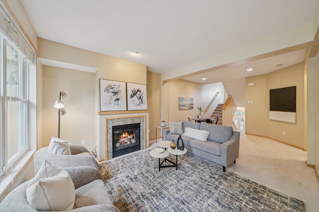 10751 Falling Water Ln Unit C, Woodbury, MN 55129 - living room featuring carpet flooring, stairway, a glass covered fireplace, and recessed lighting