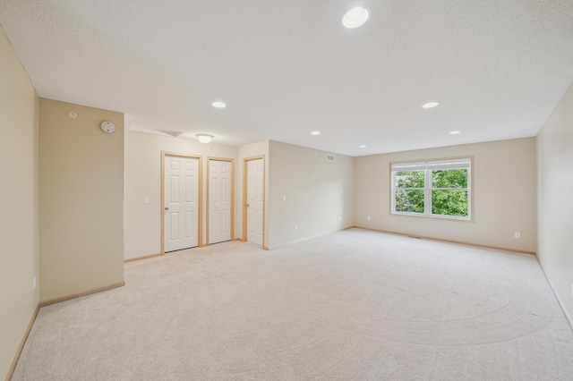 10751 Falling Water Ln Unit C, Woodbury, MN 55129 - unfurnished room with light carpet, recessed lighting, and a smoke detector