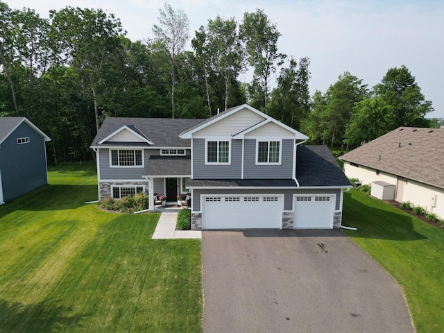 9147 Viking St, Brainerd, MN 56401 - view of front of house with stone siding, driveway, a front yard, and a garage