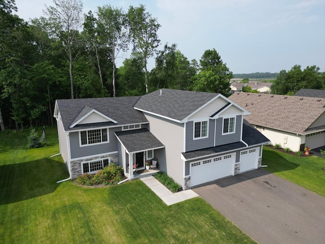 9147 Viking St, Brainerd, MN 56401 - traditional-style home featuring stone siding, asphalt driveway, a shingled roof, a front yard, and a garage