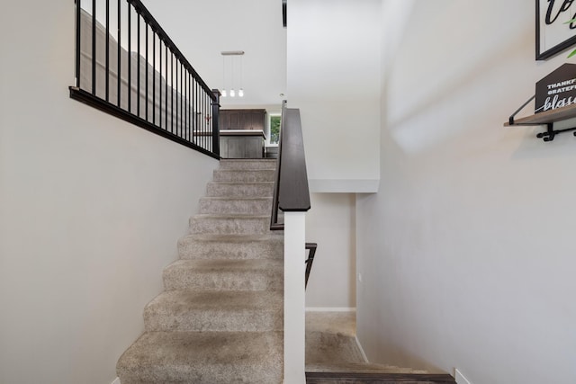 9147 Viking St, Brainerd, MN 56401 - stairs with baseboards and wood finished floors