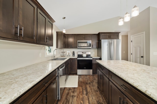 9147 Viking St, Brainerd, MN 56401 - kitchen with stainless steel appliances, dark wood-type flooring, dark brown cabinetry, hanging light fixtures, and light stone counters