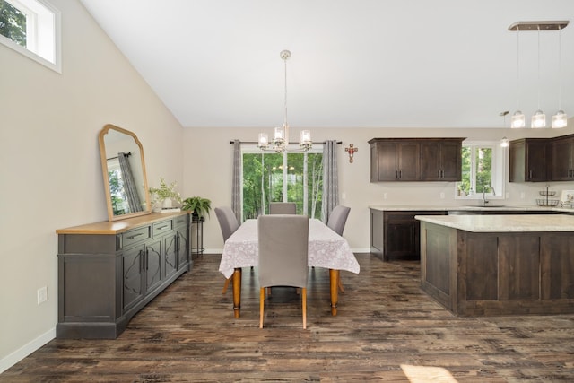9147 Viking St, Brainerd, MN 56401 - dining area with a chandelier, dark wood-style floors, and high vaulted ceiling