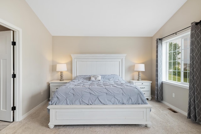 9147 Viking St, Brainerd, MN 56401 - bedroom with vaulted ceiling and light carpet