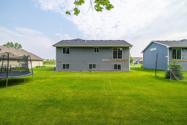 9147 Viking St, Brainerd, MN 56401 - rear view of house featuring a trampoline and a yard