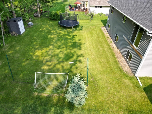 9147 Viking St, Brainerd, MN 56401 - view of yard with a trampoline and a storage unit