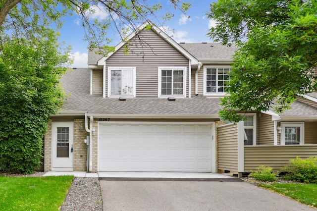 18267 Coneflower Ln, Eden Prairie, MN 55346 - view of front of home featuring roof with shingles, driveway, and an attached garage