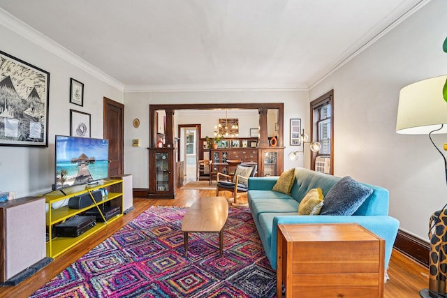 1718 Clinton Ave Unit 6, Minneapolis, MN 55404 - living room featuring a chandelier, wood finished floors, and ornamental molding