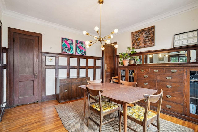 1718 Clinton Ave Unit 6, Minneapolis, MN 55404 - dining area with ornamental molding, a chandelier, and light wood finished floors