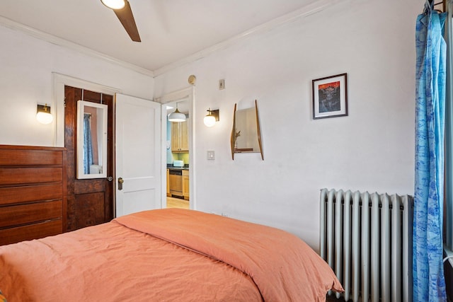 1718 Clinton Ave Unit 6, Minneapolis, MN 55404 - bedroom featuring radiator, ornamental molding, and ceiling fan