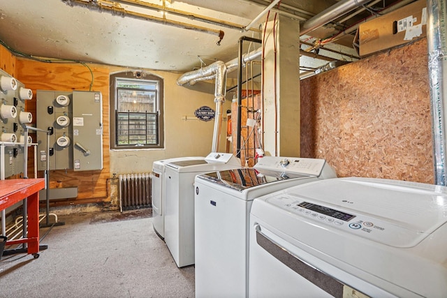1718 Clinton Ave Unit 6, Minneapolis, MN 55404 - washroom featuring radiator, washing machine and dryer, and carpet floors