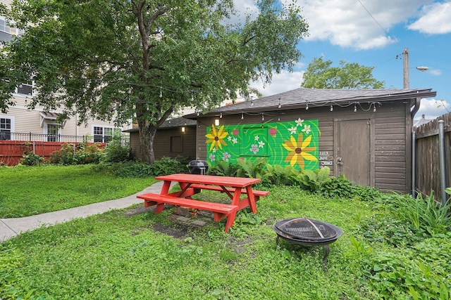 1718 Clinton Ave Unit 6, Minneapolis, MN 55404 - view of yard with a fire pit and an outbuilding