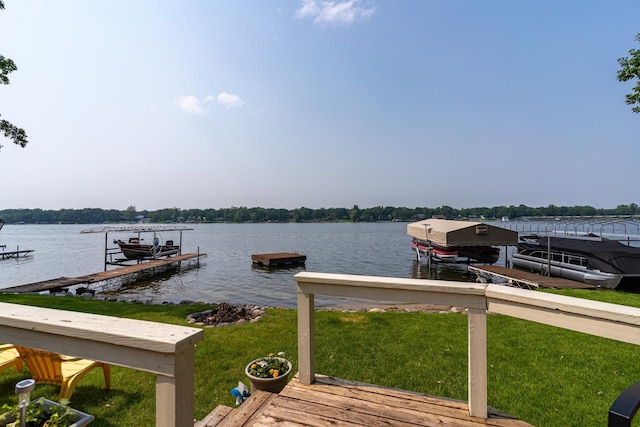 13506 Elmer Hanson Dr SE, Woodside Twp, MN 56736 - dock featuring boat lift, a water view, and a lawn