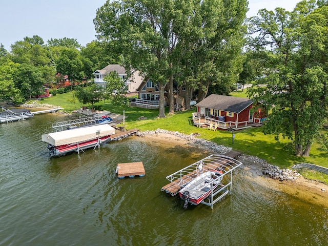 13506 Elmer Hanson Dr SE, Woodside Twp, MN 56736 - dock area featuring boat lift, a water view, and a yard