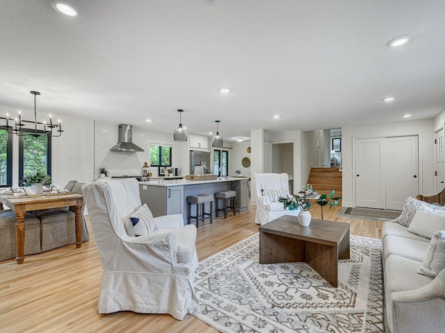 4909 Trillium Ln, Edina, MN 55435 - living area featuring a chandelier, light wood finished floors, and recessed lighting