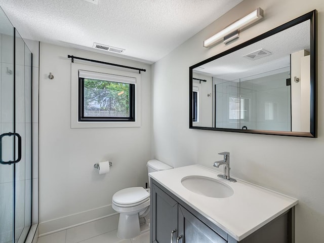 4909 Trillium Ln, Edina, MN 55435 - bathroom with vanity, a shower stall, a textured ceiling, and tile patterned floors