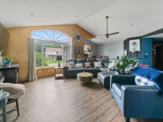 1813 Canton Rd, Prescott, WI 54021 - living area featuring a ceiling fan, light wood-style flooring, and vaulted ceiling