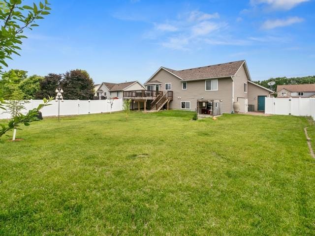1813 Canton Rd, Prescott, WI 54021 - back of property featuring stairway, a deck, and a fenced backyard