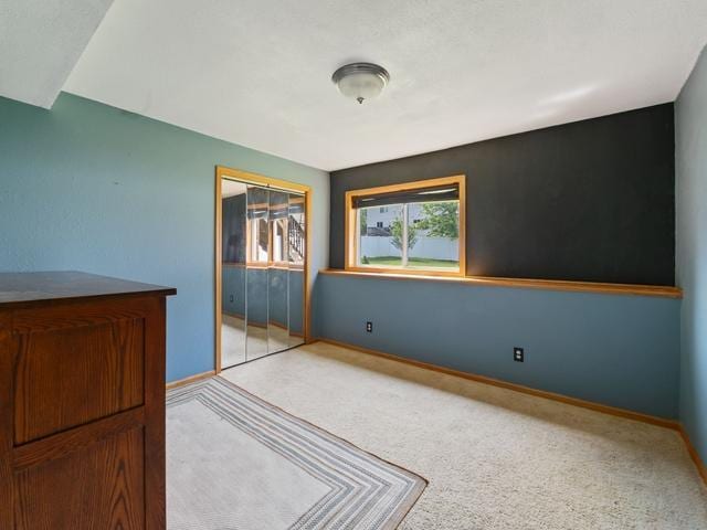1813 Canton Rd, Prescott, WI 54021 - unfurnished bedroom with a closet and light colored carpet