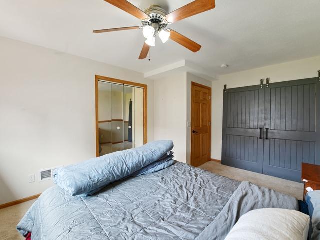 1813 Canton Rd, Prescott, WI 54021 - carpeted bedroom featuring baseboards and a ceiling fan
