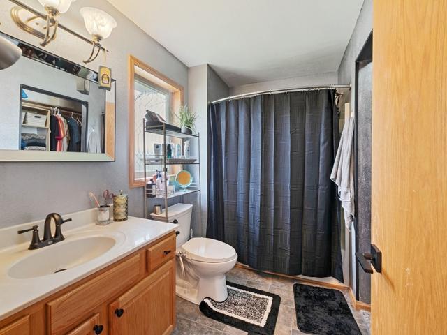 1813 Canton Rd, Prescott, WI 54021 - bathroom with vanity and a shower with shower curtain