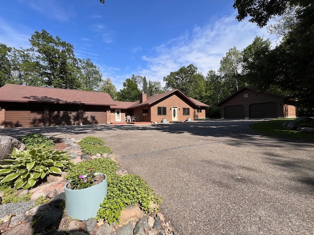 8916 Kabekona Springs Dr NW, Walker, MN 56484 - view of front of property with a chimney and an outbuilding